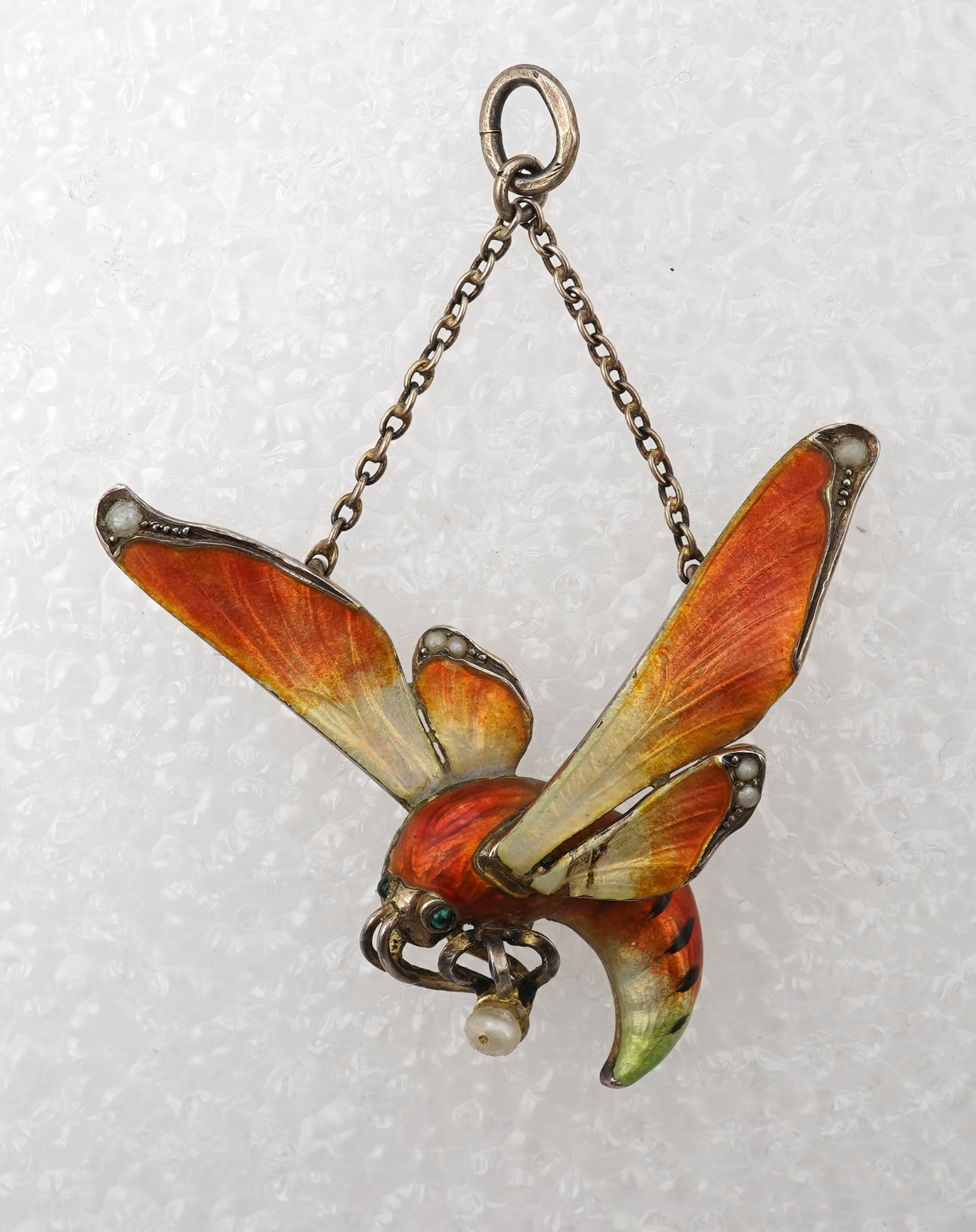 An unusual Art Nouveau silver gilt and enamel pendant, circa 1900
